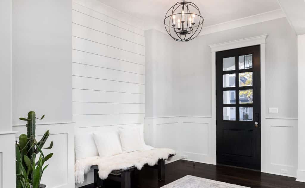 Home entryway with a shiplap accent wall