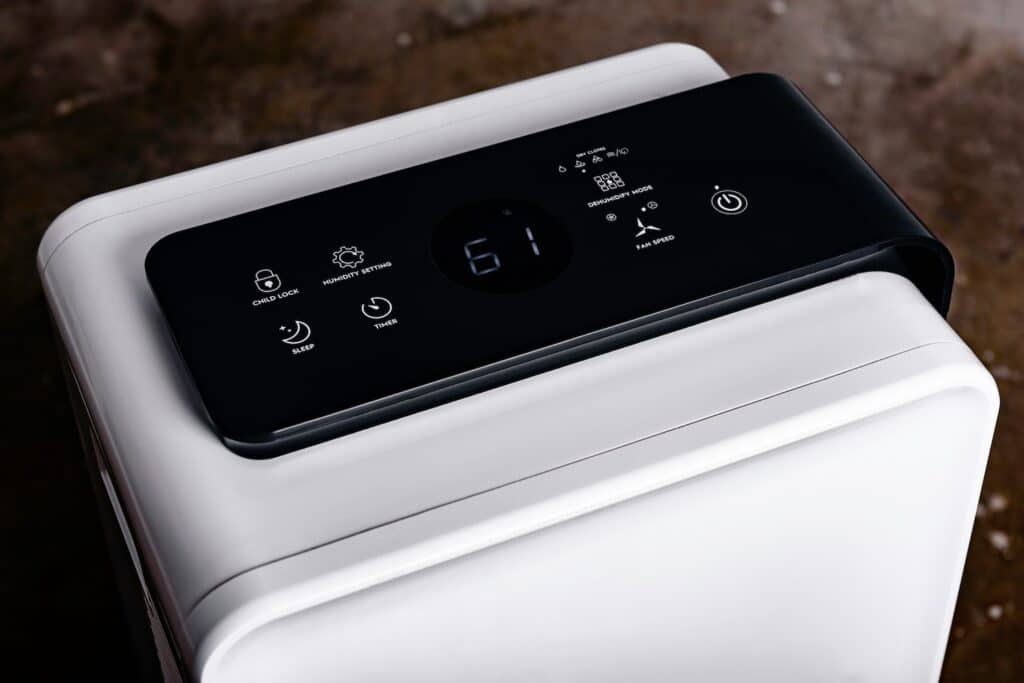 Dehumidifier with a touch panel in the basement