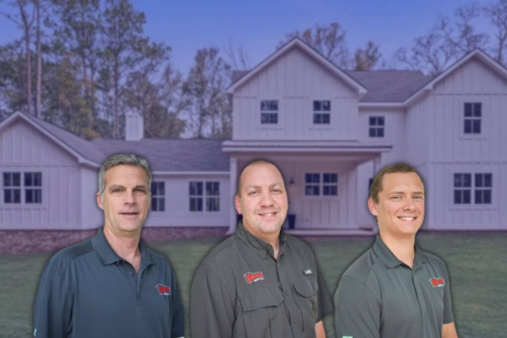 Knockout Inspections team of FORTIFIED evaluators and home inspectors in front of a home