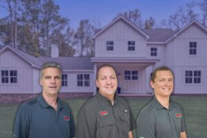 Knockout Inspections team of FORTIFIED evaluators and home inspectors in front of a home