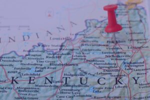 Red pushpin marking Kentucky on a state map for post Kentucky storm home inspection check-ins.